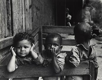 W. EUGENE SMITH (1918-1978) Hear No Evil, from the Life Magazine photo essay "A Man of Mercy." 1954; printed 1960s.                              